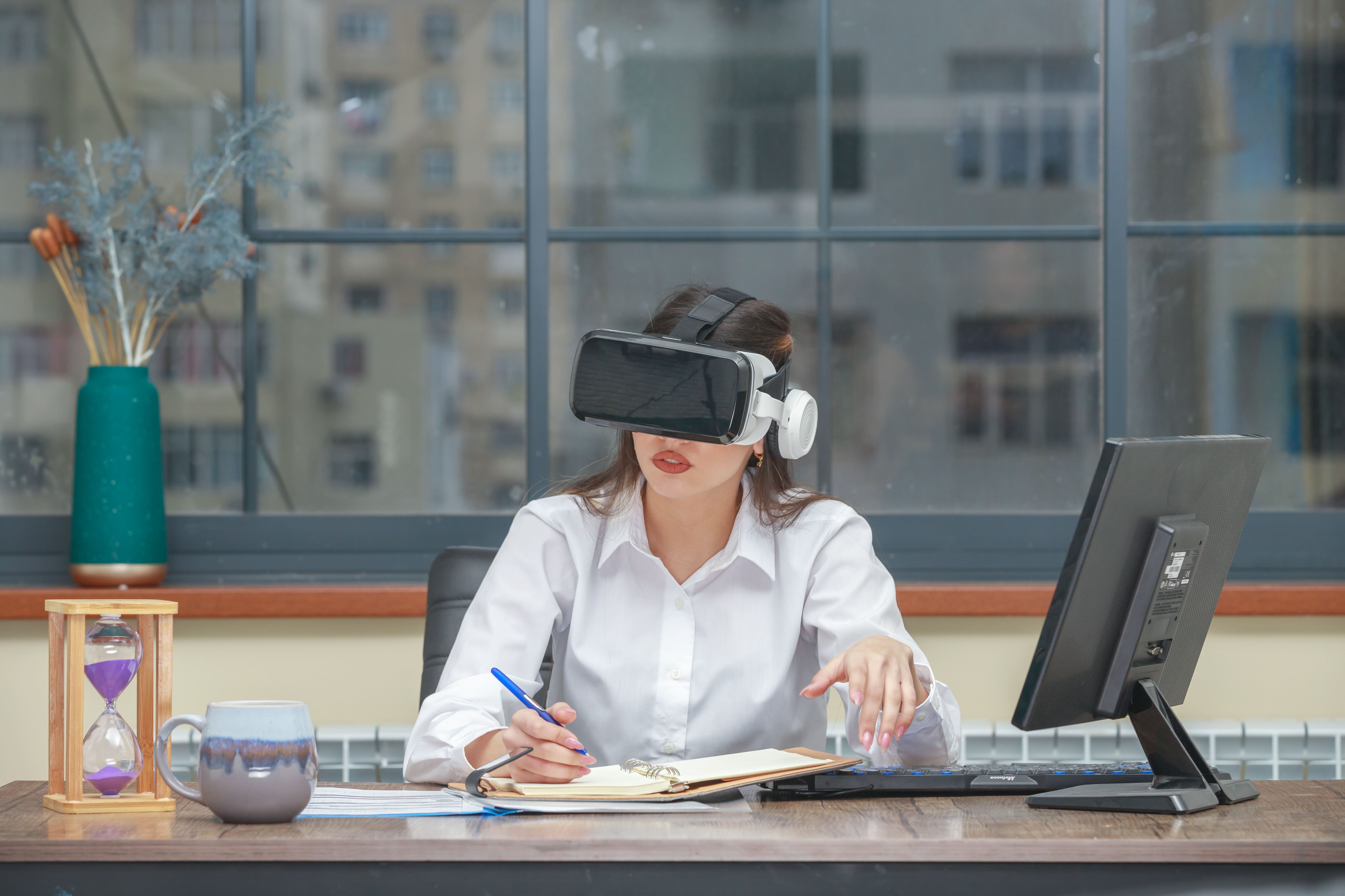 amazed-young-woman-wearing-vr-writing-min